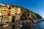 Colorful buildings overlooking the harbor in Riomaggiore, Cinque Terre, Italy.