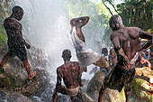 Haiti Voodoo Festival in Saut d'Eau, in Saut d'Eau, Ville Bonheur, Haiti. Thousands of both Vodou and Catholic followers gathered under the Saut d'Eau waterfall in Haiti. The pilgrimage, made by Voodou practitioners and Catholics alike, originated with the sighting of the likeness of the Virgin Mary on a palm leaf close to the falls half a century ago. Catholism and Voodou practices are forever intertwined in its Haitian form. The appearance of a rainbow beneath the falls is said indicate that Danbala - the great lord of the waterfall - and Ayida Wedo - the rainbow - are making love. Fertility