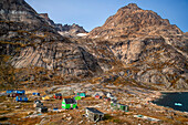 Coloful houses in the small isolated inuit village of Aappilattoq, South Greenland, Arctic sea.