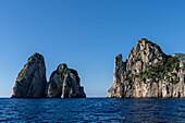 The Farallons or faraglioni, sea stacks off the coast of the island of Capri, Italy. L-R: Scopolo or Fuori, Mezzo with its sea arch & Stella.