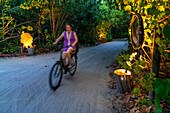 Ride a bicycle in luxury water villas of Six Senses Laamu maldives luxury resort villas, Laamu Atoll region Maldives