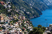 The seaside resort town of Positano terraced on the steep hillside of the Amalfi Coast in Italy.