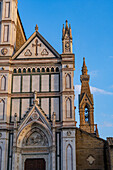 The facade and campanile of the Basilica of Santa Croce or Basilica of the Holy Cross in Florence, Italy.