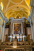 Altar and alterpiece painting in the Church of San Francesco di'Assisi in the historic center of Sorrento, Italy.