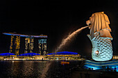 The Merlion Statue, symbol of Singapore at night and Marina Bay Sands Hotel, overlooking Marina Bay, Merlion Park, Singapore City, Singapore