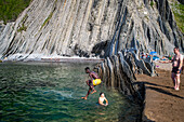 Itzurun beach and Flysch de Zumaia flysch, sedimentary rock formations, Basque Coast Geopark, Zumaia, Gipuzkoa, Basque Country, Spain