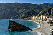 The Fegina beach in off peak season in Monterosso al Mare, Cinque Terre, Italy, with the Scoglio Malpasso or Malpasso Rock.