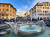 The Sallustiano Obelisk & Trinita dei Monti Church at the top of the Spanish Steps in Rome, Italy. In front is the Fountain of the Boat or Fontana della Barcaccia.