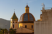 Golden sunset light on the bell tower & dome of the Church of San Gennaro in Vettica Maggiore, Praiano, Italy.