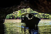 Boat trip at the Kilim Geoforest Park Jetty. Tourist boat starts their journey throw the mangrove forest. Island most exquisite and geologically significant landscapes