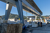 A buyer negotiates for marble at a marble supply company yard in Carrara, Italy.