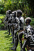 The Skeleton Men from the Omo Bugamo tribe of Papua New Guinea paint their bodies with black and white paint emulating the human skeleton, Chimbu Province, Papua New Guinea