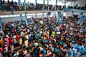 Inside the church of Our Lady of Mount Carmel. Haiti Voodoo Festival in Saut d'Eau, in Saut d'Eau, Ville Bonheur, Haiti. Thousands of both Vodou and Catholic followers gathered under the Saut d'Eau waterfall in Haiti. The pilgrimage, made by Voodou practitioners and Catholics alike, originated with the sighting of the likeness of the Virgin Mary on a palm leaf close to the falls half a century ago. Catholism and Voodou practices are forever intertwined in its Haitian form. The appearance of a rainbow beneath the falls is said indicate that Danbala - the great lord of the waterfall - and Ayida 