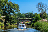 Boat in the Canal du Midi near Carcassonne Aude South of France southern waterway waterways holidaymakers queue for a boat trip on the river, France, Europe