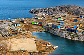 Coloful houses in the small isolated inuit village of Aappilattoq, South Greenland, Arctic sea.