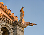 One of the four Evangelists on the corner of the west facade of the Pisa Cathedral. Pisa, Italy.