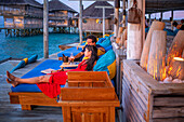 Relaxing in the bar restaurant of the Six Senses Laamu maldives luxury resort villas, Laamu Atoll region Maldives