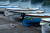 Wooden rowboats hauled out on the ramp in the Marina Grande harbor on the island of Capri, Italy.