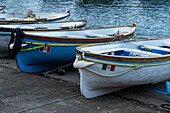 Wooden rowboats hauled out on the ramp in the Marina Grande harbor on the island of Capri, Italy.