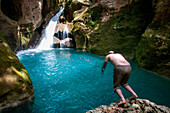 Exploring the cobalt waters of Bassin Bleu waterfall composed of bassin yes, bassin palmiste and bassin clair, Maire de Jacmel, Jacmel, Haiti