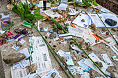 Montparnasse Cemetery, Paris, France. Gifts in the grave of Jean-Paul Sartre and Simone de Beauvoir on Montparnasse Cemetery, Paris, France. A famous couple, was of the most influential and controversial writers and thinkers of the 20th century