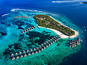 Aerial view of the luxury ower water villas of Six Senses Laamu maldives luxury resort villas, Laamu Atoll region Maldives