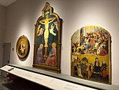 Renaissance paintings in the Accademia Gallery in Florence, Italy. L-R: Madonna and Child, artist unknown, circa 1360-1365; Crucifixion with Four Angels by Jacopo di Cione, circa 1370 A.D.; Massacre of the Innocents, Adoration of the Magi, Flight into Egypt, by the Jacopo di Cione workshop, circa 1375-1385.