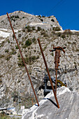 A display of drill bits and pneumatic drill for splitting marble blocks. Fantiscritti Quarry Museum, Carrara, Italy.