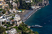 The seaside resort town of Positano terraced on the steep hillside of the Amalfi Coast in Italy.