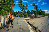 Tourist girl in a bike in Sipaway Island, San Carlos City, Negros Occidental, Philippines