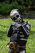 The Skeleton Men from the Omo Bugamo tribe of Papua New Guinea paint their bodies with black and white paint emulating the human skeleton, Chimbu Province, Papua New Guinea