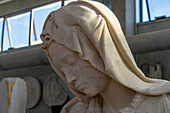 A cast resin model with reference marks in a carving studio in Carrara, Italy. The reference marks are used for measurements when carving the actual statue from marble.