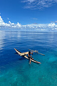 Resident of Vitu Islands in their traditional dugout canoes, Lama Anchorage, New Britain, Papua New Guinea