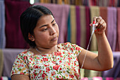 Woman spinning Cotton San Juan la Laguna, Lake Atitlan, Guatemala