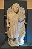 A carved marble statue of a young falconer from the 13th Century A.D. in the Museum of the Duomo of Ravello, Italy.