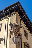 The Medici coat of arms on the Archbishop's Palace on the Piazza San Giovanni in Florence, Italy.