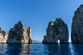 The Farallons or faraglioni, sea stacks off the coast of the island of Capri, Italy. L-R: Stella, Mezzo with its sea arch & Scopolo or Fuori.