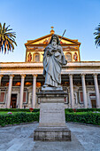 The statue of St. Paul and facade of the Basilica of St. Paul Outside the Walls, Rome, Italy.