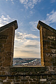 View of the Arno River through the crenellations of the tower of the Palazzo Vecchio, Florence, Italy.