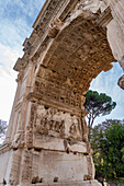 Detail of the Arch of Titus in the Roman Forum in the Colosseum Archaeological Park, Rome, Italy. Depicted is the spoil of Jerusalem.