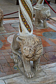 A carved marble lion supporting the 13th Century Gospel Pulpit in the Ravello Duomo in Ravello, Italy.