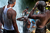 Haiti Voodoo Festival in Saut d'Eau, in Saut d'Eau, Ville Bonheur, Haiti. Thousands of both Vodou and Catholic followers gathered under the Saut d'Eau waterfall in Haiti. The pilgrimage, made by Voodou practitioners and Catholics alike, originated with the sighting of the likeness of the Virgin Mary on a palm leaf close to the falls half a century ago. Catholism and Voodou practices are forever intertwined in its Haitian form. The appearance of a rainbow beneath the falls is said indicate that Danbala - the great lord of the waterfall - and Ayida Wedo - the rainbow - are making love. Fertility