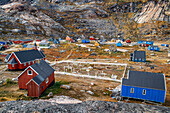 Coloful houses in the small isolated inuit village of Aappilattoq, South Greenland, Arctic sea.