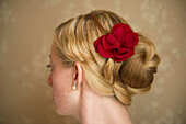 Artificial flower as a hair accessory in a hairstyle; Lincoln, Nebraska, United States of America