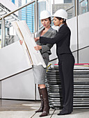 Businesswomen Looking at Plans