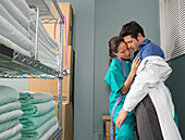 Doctor and Nurse Kissing in Supply Room
