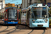 Sheffield trams (Supertram) approaching a stop in Church Street, Cathedral Quarter, Sheffield, Yorkshire, England