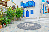 Traditional pebble mosaic adorning Mandraki old town, Mandraki, Nisyros Island, Dodecanese Islands, Greek Islands, Greece, Europe