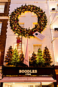 Christmas Decorations at Boodles Jewellery Shop at dusk, New Bond Street, London, England, United Kingdom