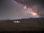 Yurts illuminated by the Milky Way in the Song Kol Lake area, Kyrgyzstan